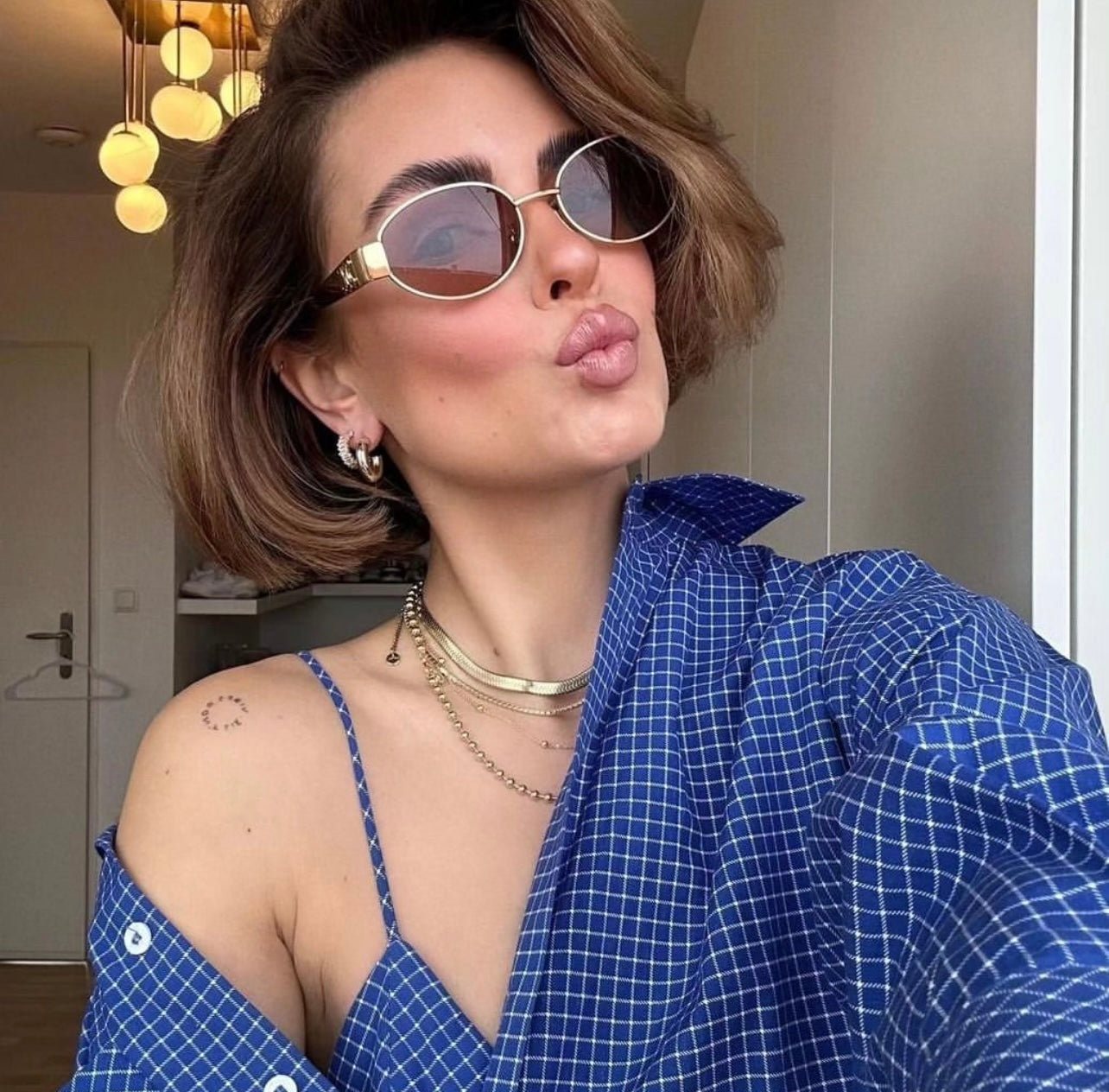 CELINE EYEWEAR
Triomphe Metal 01 oval sunglasses